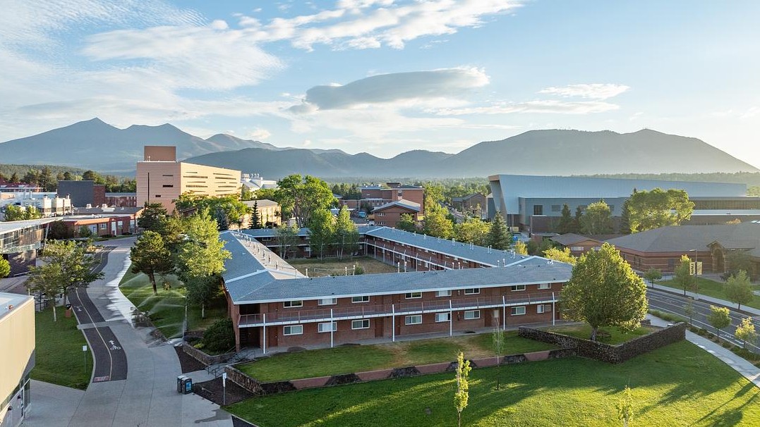 Aerial view of the NAU campus with San Francisco Peaks in the background 