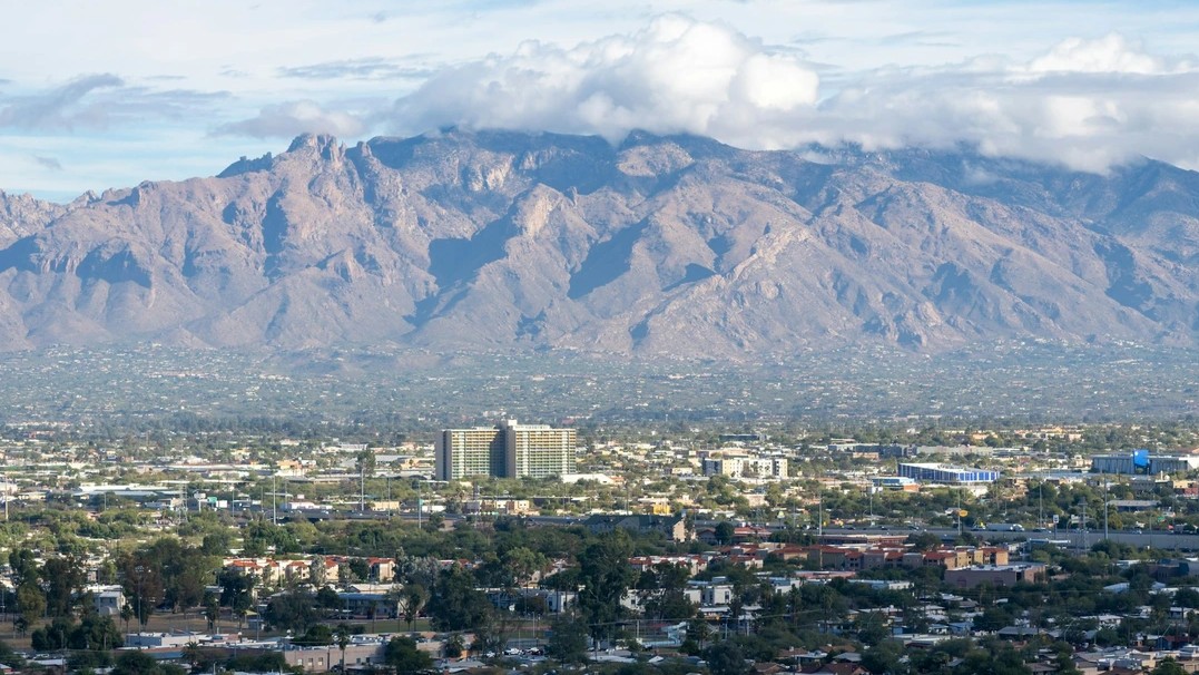 Photo of Tucson with mountains in the background. 