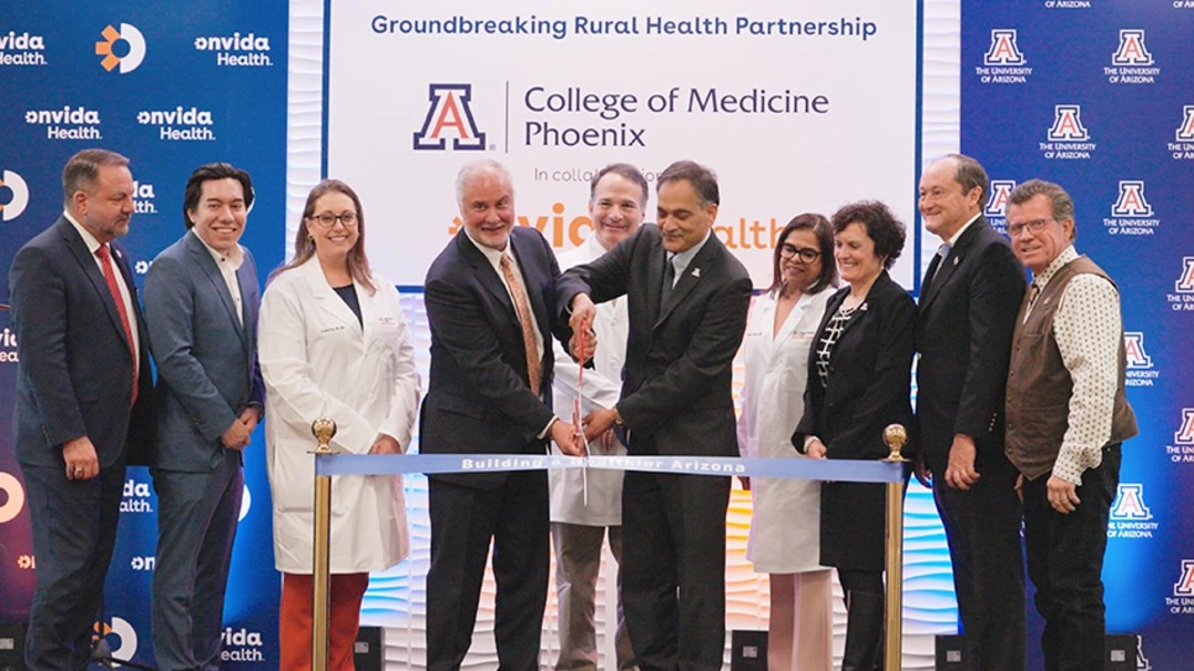 Image of a ribbon cutting ceremony to launch the partnership with Mayor of Yuma Douglas Nicholls; State Sen. Brian Fernandez; Dr. Kristina Diaz, president of Onvida Health Medical Group; Dr. Robert J. Trenschel, president and CEO of Onvida Health; U of A President Suresh Garimella; Patricia A. Prelock, provost and chief academic officer at the U of A; Doug Goodyear, chair of the Arizona Board of Regents; and State Sen. Timothy Dunn.