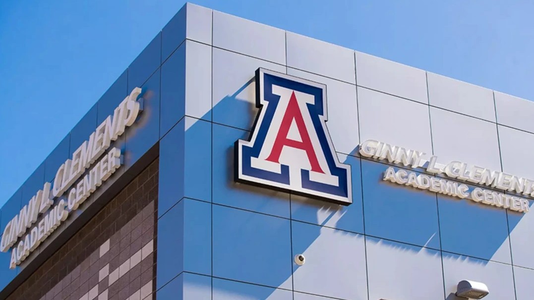 Image of the corner of the Ginny Clements Academic Center with the U of A "A" logo on the side of the building 