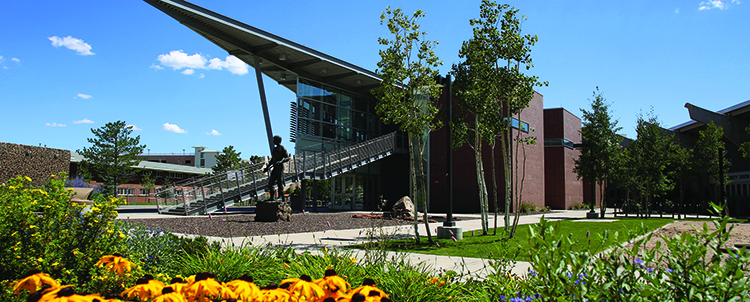 Photo of the NAU Union building exterior with flowers in the foreground